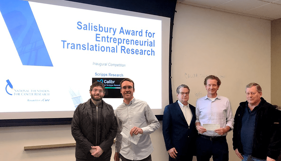 Inaugural Salisbury Award winner Eduardo Laborda (2nd from Left) and runner-up Luke Lairson (4th), alongside Scripps Research and Calibr COO Matt Tremblay (1st), NFCR CEO Emeritus Franklin Salisbury, Jr., (3rd) and NFCR Scientific Advisory Board Chairman Webster Cavenee (5th) Inaugural Salisbury Award winner Eduardo Laborda (2nd from Left) and runner-up Luke Lairson (4th), alongside Scripps Research and Calibr COO Matt Tremblay (1st), NFCR CEO Emeritus Franklin Salisbury, Jr., (3rd) and NFCR Scientific Advisory Board Chairman Webster Cavenee (5th)