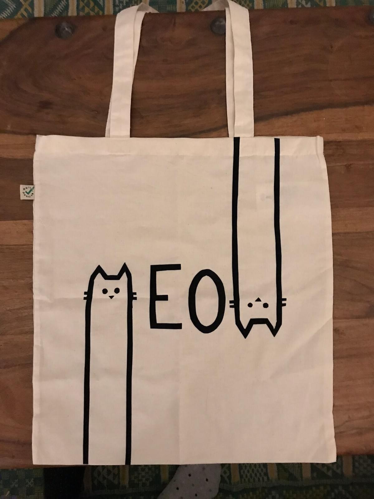 Printed tote bag with 'Meow' written across. The M and W are cat faces Printed tote bag with 'Meow' written across. The M and W are cat faces