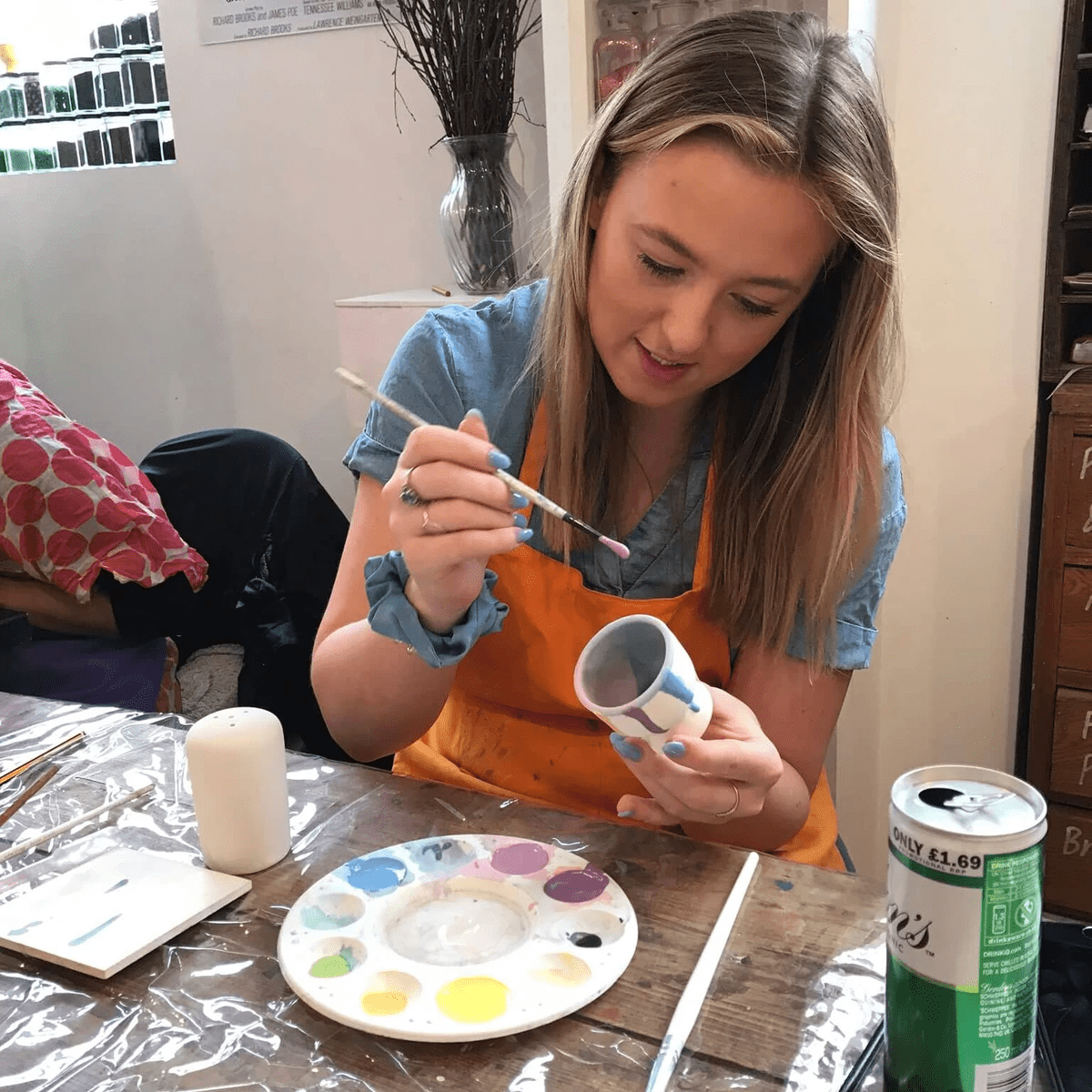 Kirsty's sister painting an egg cup Kirsty's sister painting an egg cup