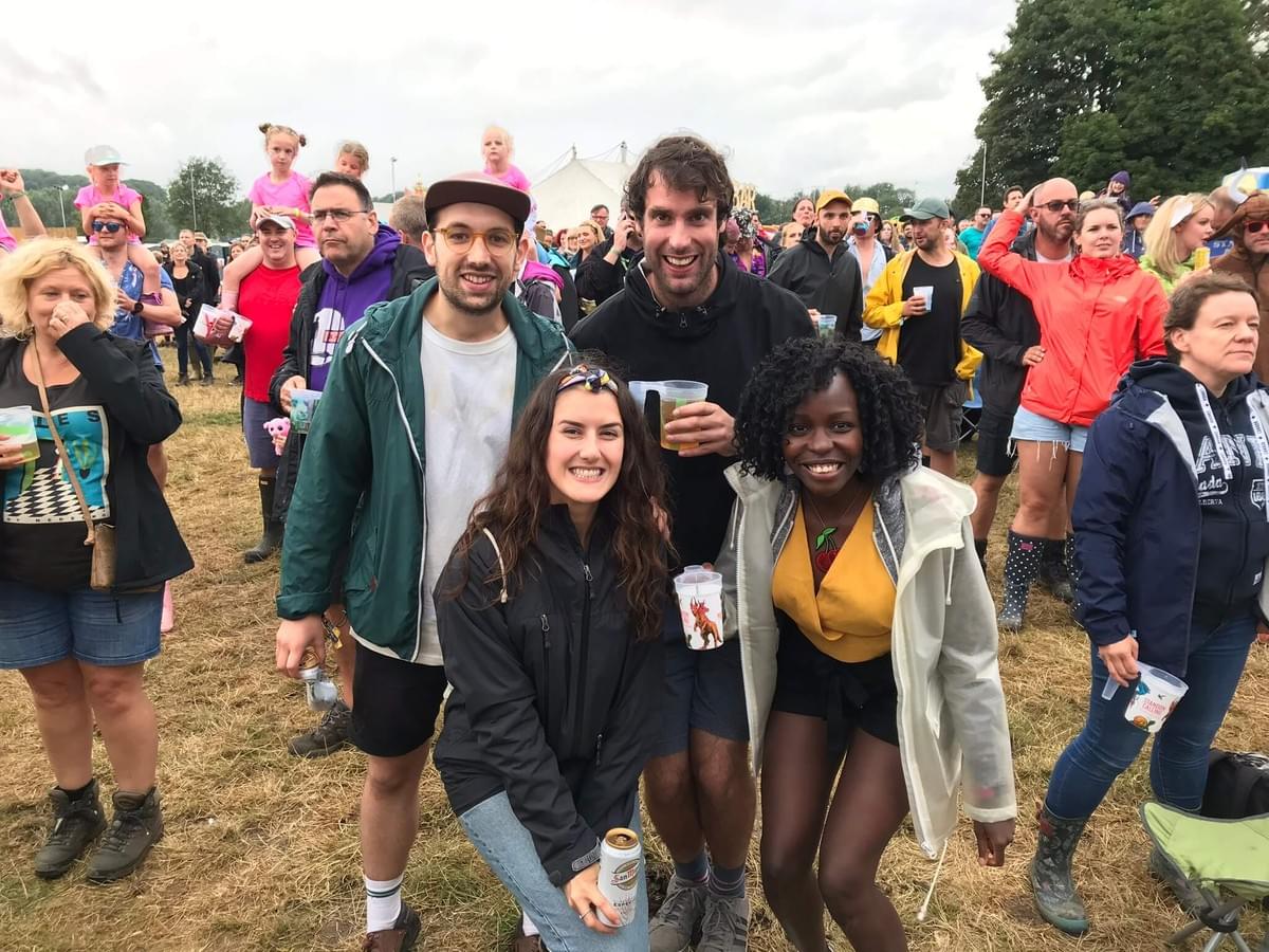 Tom, Kirsty, Sam and Diana in a field, smiling at the camera Tom, Kirsty, Sam and Diana in a field, smiling at the camera