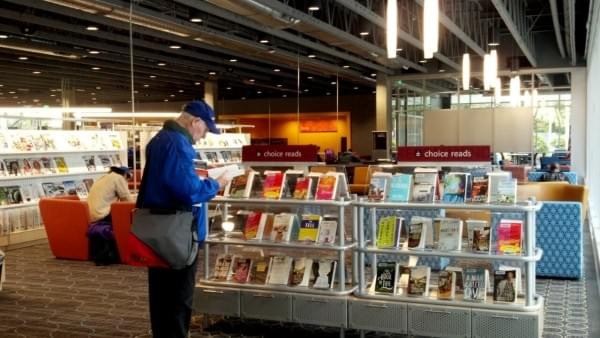Man reads book at the KCLS Renton Library at Cedar River at the grand opening, Renton, Wash. Man reads book at the KCLS Renton Library at Cedar River at the grand opening, Renton, Wash.