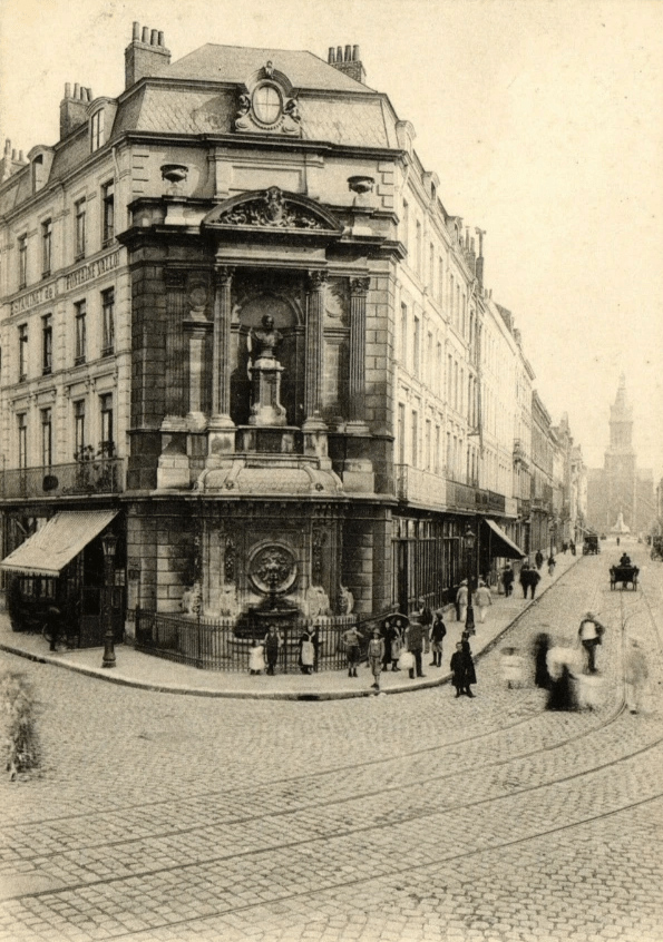 Lille La fontaine Vallon à l'entrée de la rue Nicolas Leblanc. Au fond à droite : l'église Saint-Michel Le tramway est bien présent dans la rue grâce à ligne L (Lille-Wattignies) qui devient en 1955 la ligne C (supprimée en 1962) Lille La fontaine Vallon à l'entrée de la rue Nicolas Leblanc. Au fond à droite : l'église Saint-Michel Le tramway est bien présent dans la rue grâce à ligne L (Lille-Wattignies) qui devient en 1955 la ligne C (supprimée en 1962)