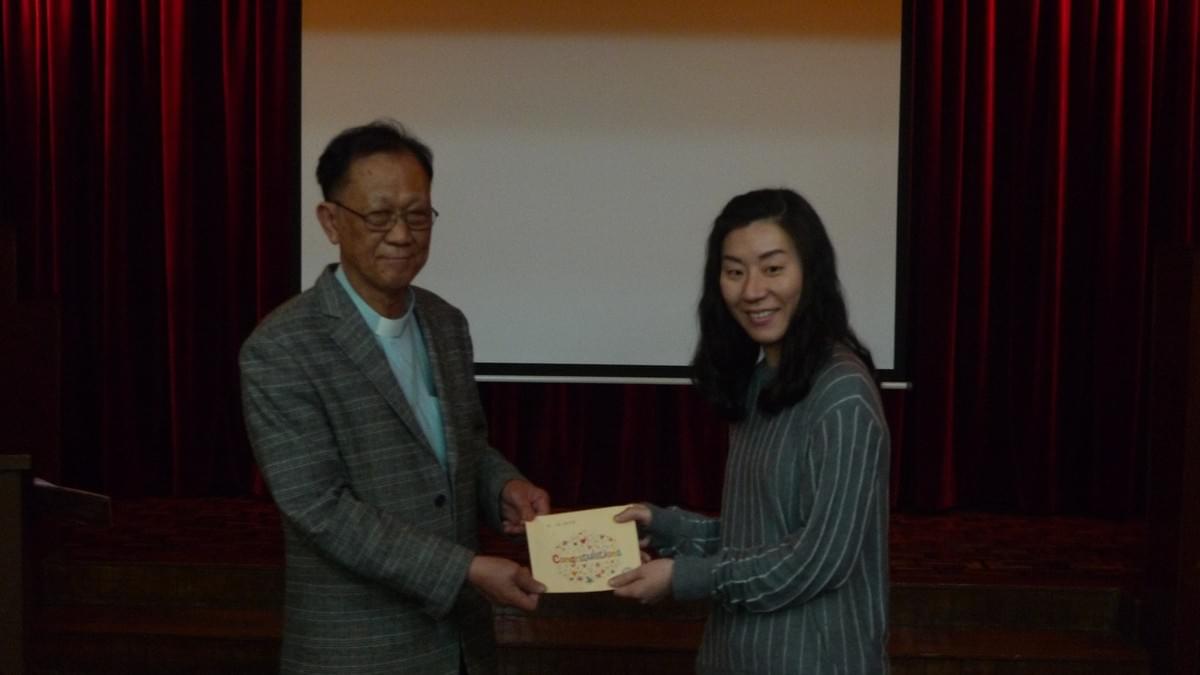 Dr. IP Awarding the Scholarship to Ms. CHEN Siu Lan Dr. IP Awarding the Scholarship to Ms. CHEN Siu Lan
