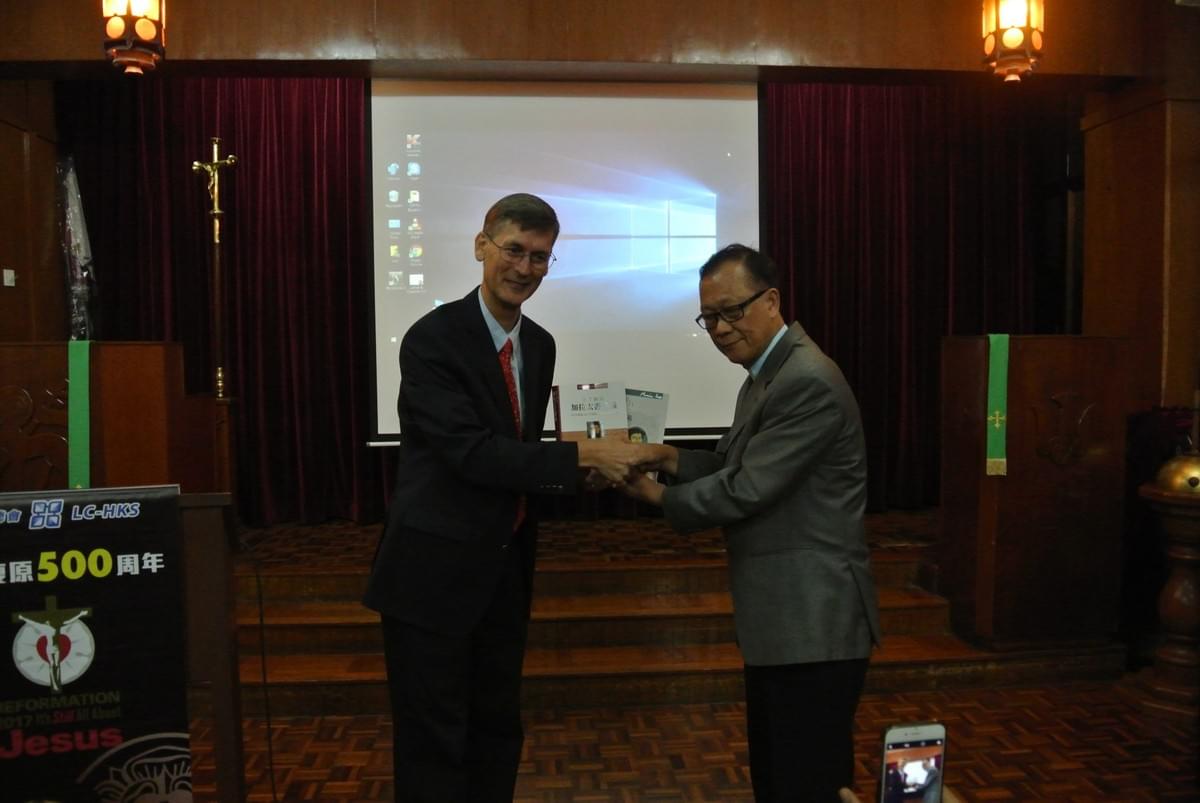 Dr. OLIVER Presenting Luther's Biblical Commentaries in Chinese to Dr. IP as a Gift Dr. OLIVER Presenting Luther's Biblical Commentaries in Chinese to Dr. IP as a Gift