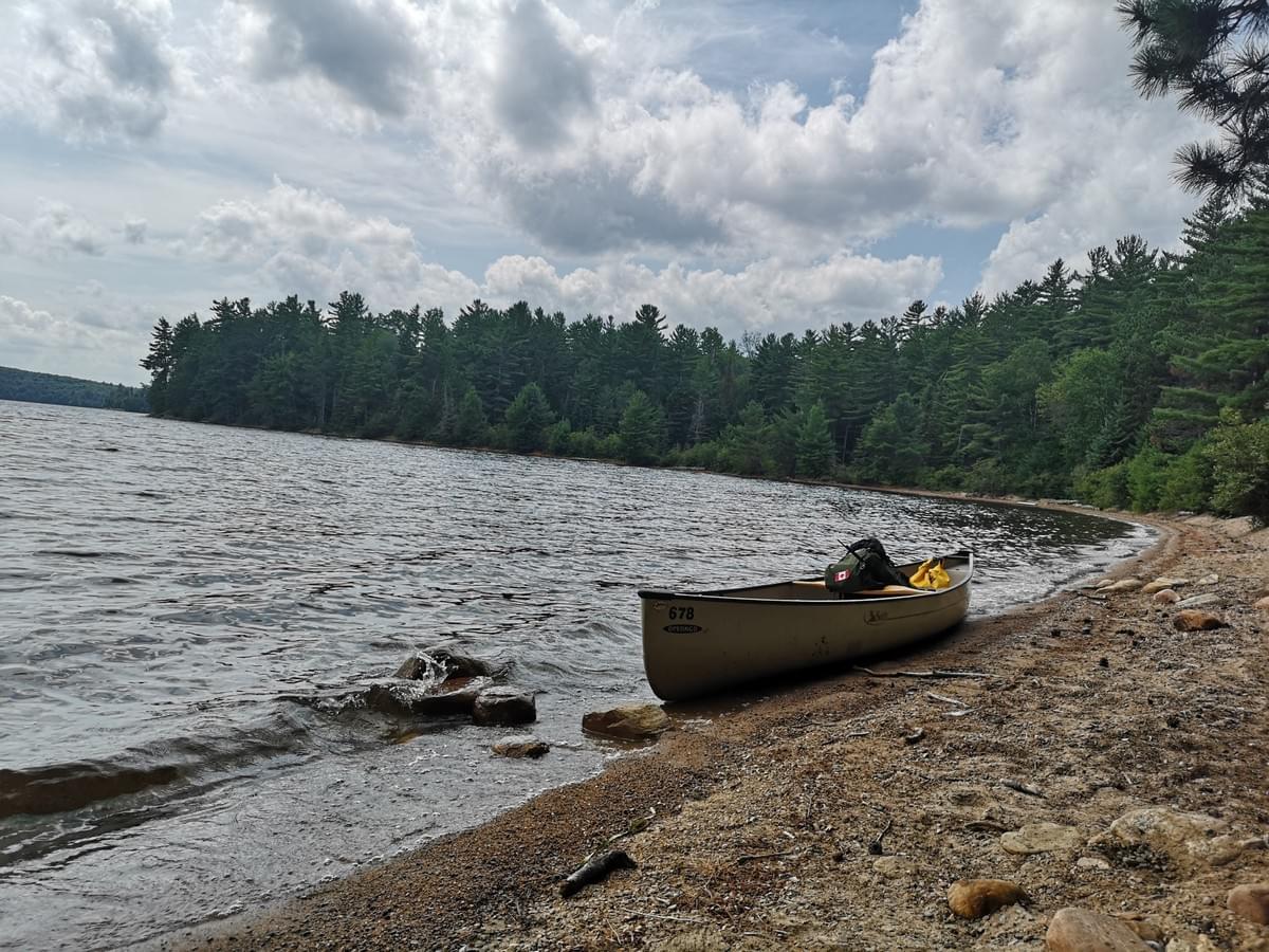 canoe full of camping gear on a beach at Opeongo Lake, Algonquin Provicial Park canoe full of camping gear on a beach at Opeongo Lake, Algonquin Provicial Park
