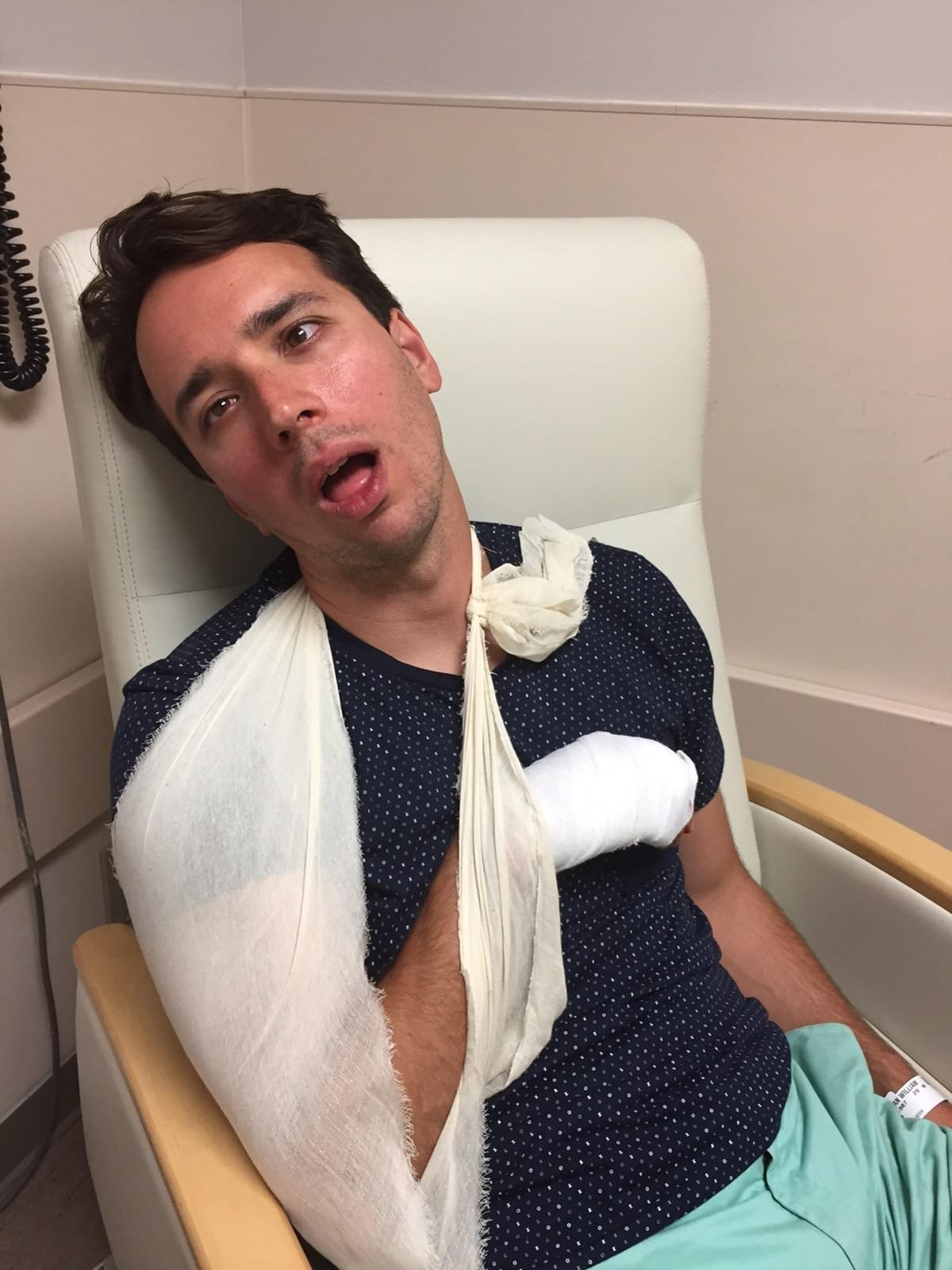man with an injured arm in a sling man with an injured arm in a sling