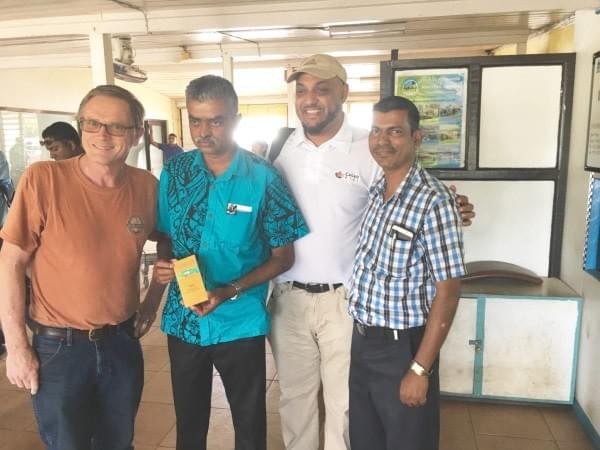 Asst Agriculture Minister of Fiji Mr. Viam Pillay holding a craft chocolate bar by Ned & Debi of Cello Chocolate Asst Agriculture Minister of Fiji Mr. Viam Pillay holding a craft chocolate bar by Ned & Debi of Cello Chocolate
