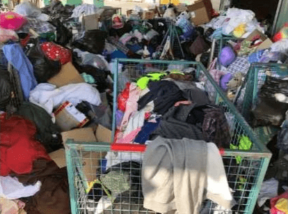 Piles of old clothes await resale and recycling at The Green Shed in Canberra Piles of old clothes await resale and recycling at The Green Shed in Canberra