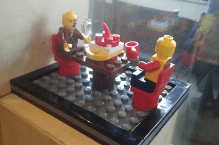 Lego sculpture of two people eating in a cafe Lego sculpture of two people eating in a cafe