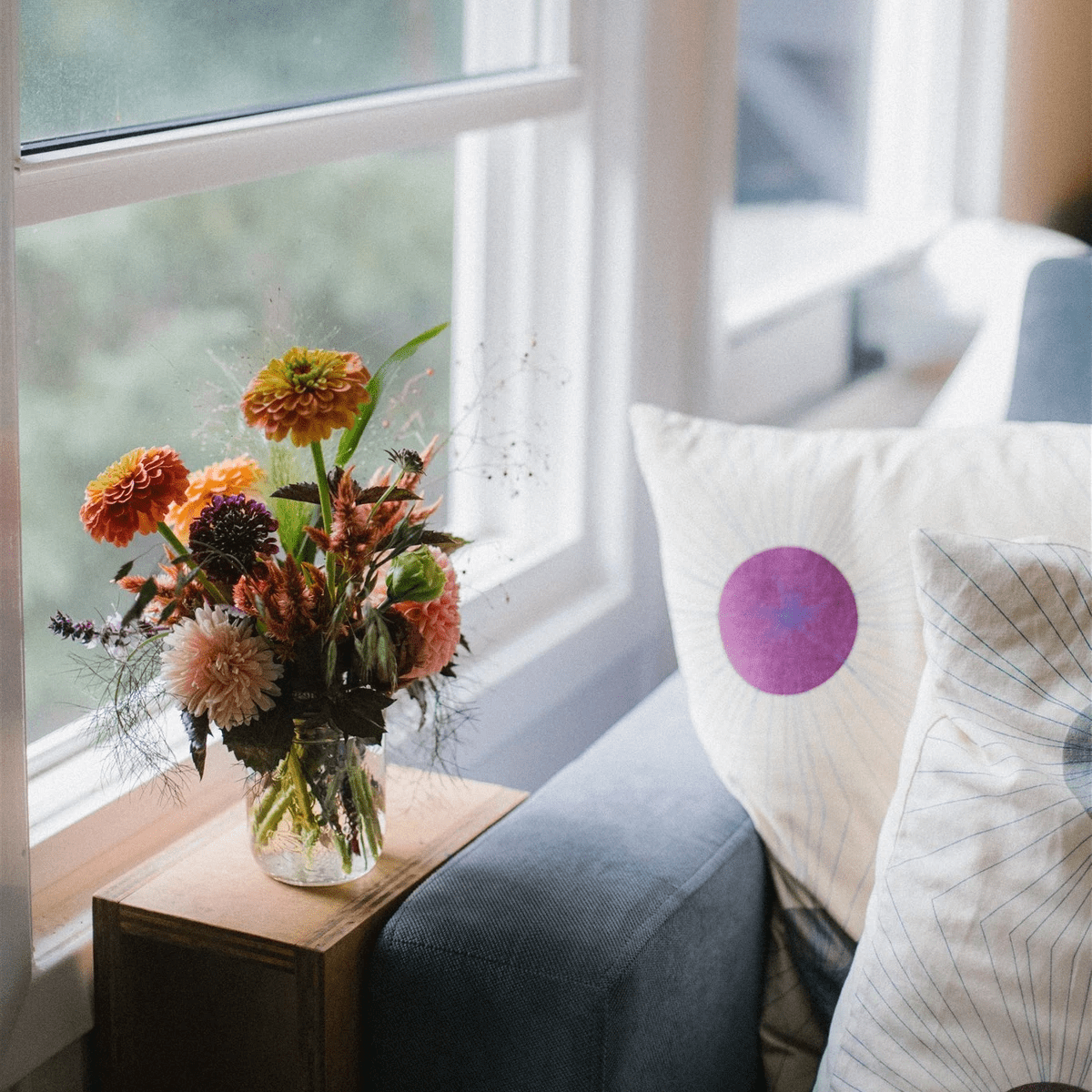 Mason jar floral arrangement in a peach, orange, terracotta and burgundy palette in the living room of a Grey County chalet. Mason jar floral arrangement in a peach, orange, terracotta and burgundy palette in the living room of a Grey County chalet.