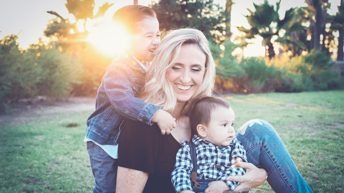 A happy woman with her two children A happy woman with her two children