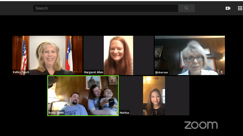 Am image of a judge, an attorney, and families communicating on zoom Am image of a judge, an attorney, and families communicating on zoom