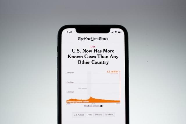 image of a cell phone displaying New York Times article with the headline U.S. Now Has More Known Cases Than Any Other Country image of a cell phone displaying New York Times article with the headline U.S. Now Has More Known Cases Than Any Other Country