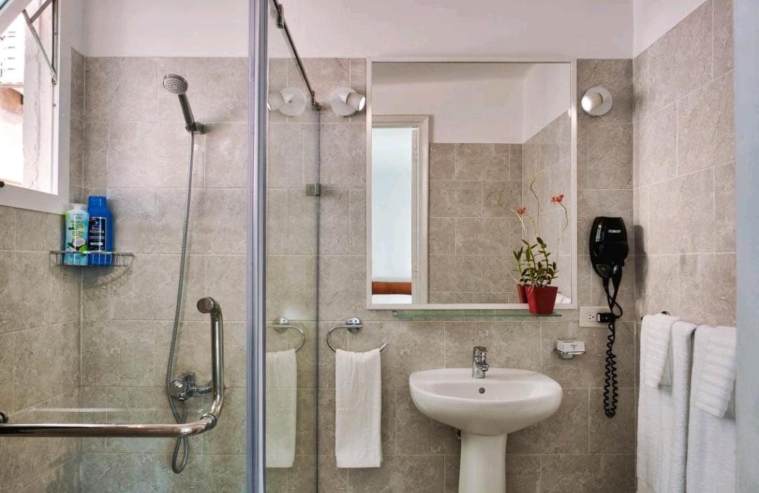 The bathroom is modern and convenient and it includes a professional hair dryer. The bathroom is modern and convenient and it includes a professional hair dryer.