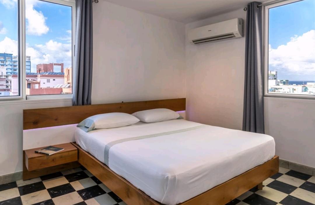 The king size bed is comfortable with while clean sheets. The king size bed is comfortable with while clean sheets.
