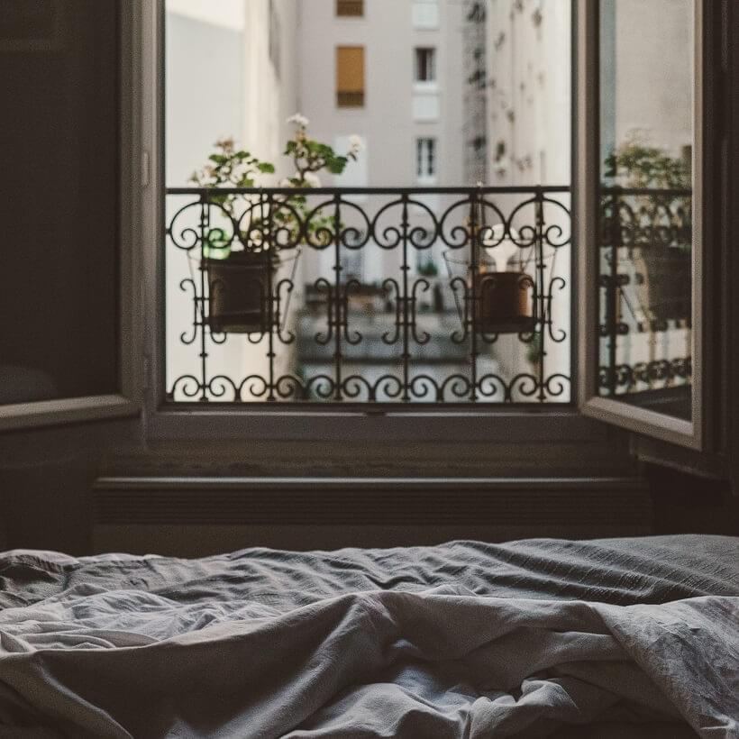 A photo of the view from a bed looking out of an open window as featured in The Purple Dog Blog post "* Simple Rules for Better Mornings" by The Purple Dog Vegan A photo of the view from a bed looking out of an open window as featured in The Purple Dog Blog post "* Simple Rules for Better Mornings" by The Purple Dog Vegan