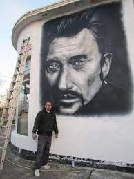 un graffeur rend hommage à Johny dans la ville de Dijon en cote d'or un graffeur rend hommage à Johny dans la ville de Dijon en cote d'or
