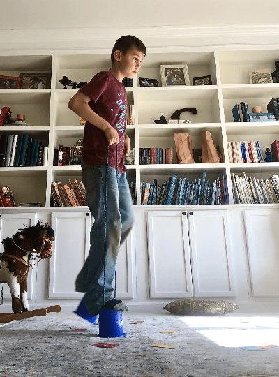 Occupational therapy at home for homeschooled boy. Visual scanning letters while on stilts. Occupational therapy at home for homeschooled boy. Visual scanning letters while on stilts.