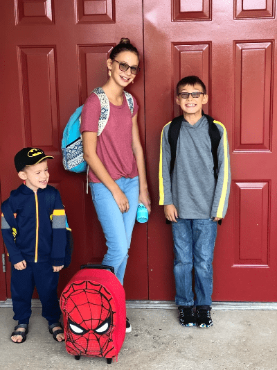 Three smiling homeschooled children entering their co-op for auditory, kinesthetic, and visual learners. Three smiling homeschooled children entering their co-op for auditory, kinesthetic, and visual learners.