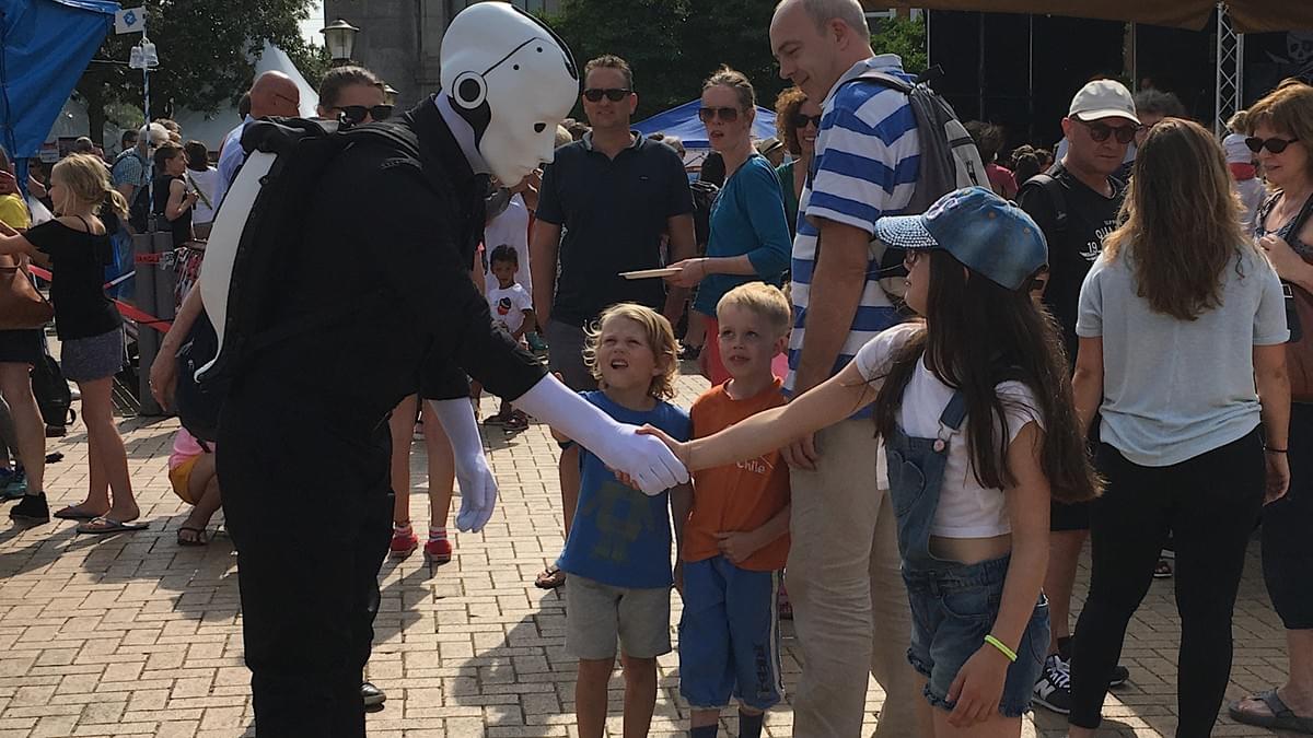 Say hello to the future - Silent Rocco’s Menschine robot walkabout act at a street festival Say hello to the future - Silent Rocco’s Menschine robot walkabout act at a street festival
