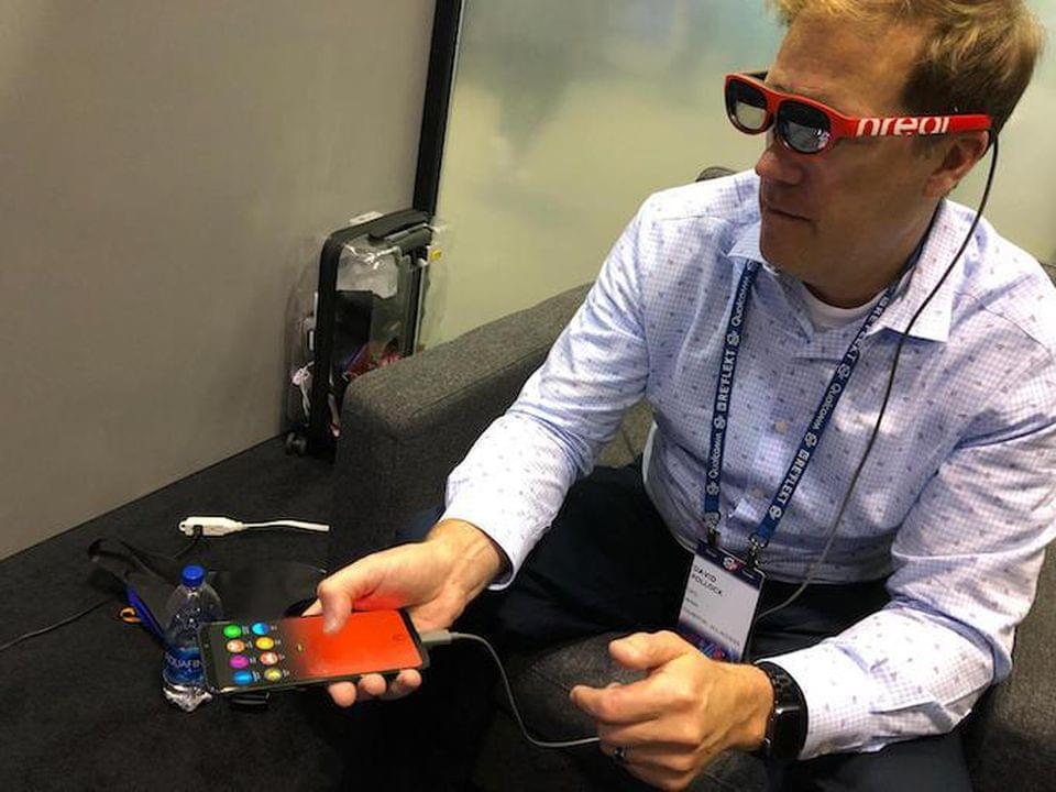 Dave Pollock tries out the nReal. The smartphone can act as a controller. DAVE POLLOCK Dave Pollock tries out the nReal. The smartphone can act as a controller. DAVE POLLOCK