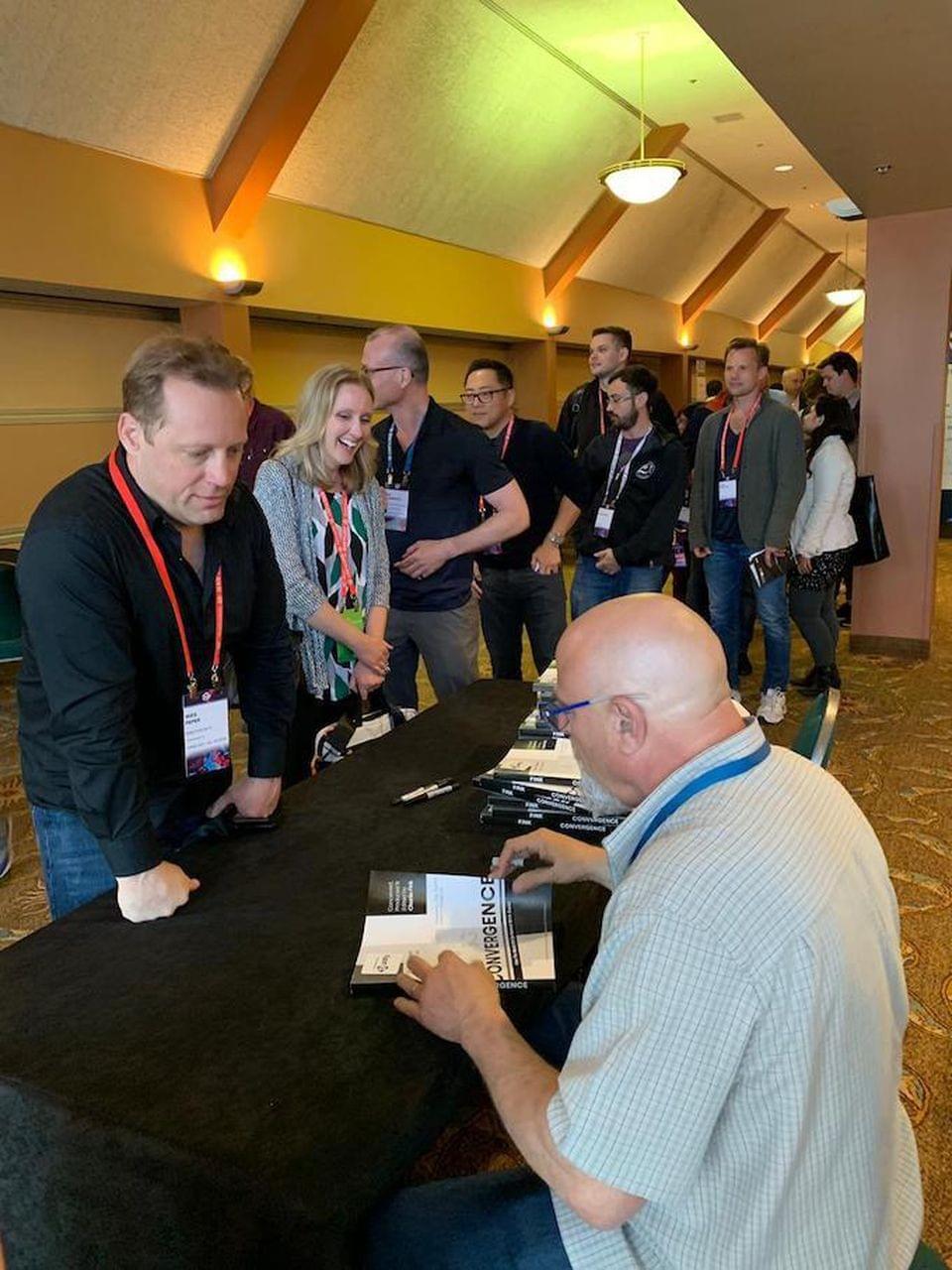 Charlie Fink signed 330 copies of "Convergence," compliments of Unity, during the Conference. JAY LATTA Charlie Fink signed 330 copies of "Convergence," compliments of Unity, during the Conference. JAY LATTA