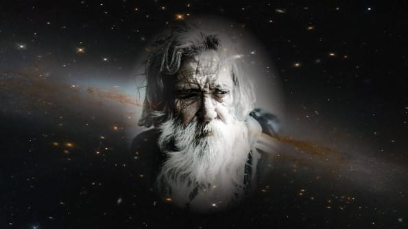 A bearded and wise-looking man stares out from deep space. A bearded and wise-looking man stares out from deep space.
