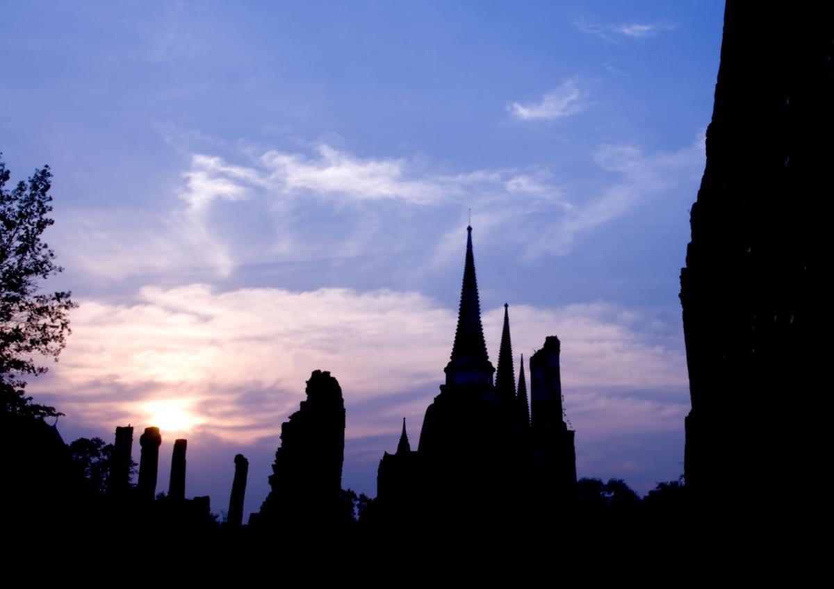Image of eastern temples silhouetted against a sunrise. Image of eastern temples silhouetted against a sunrise.