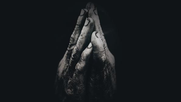 Two hands clasped together in prayer. Two hands clasped together in prayer.