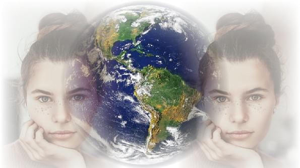 Two images of the same woman stare at us. Between her images is our Earth as seen from space. Two images of the same woman stare at us. Between her images is our Earth as seen from space.