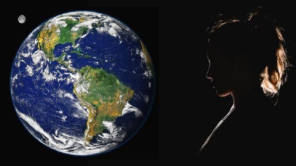 A woman is backlit in space as she stares at our Planet Earth A woman is backlit in space as she stares at our Planet Earth