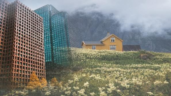 High rise tower blocks overshadow a meadow. In the background is a small cottage. High rise tower blocks overshadow a meadow. In the background is a small cottage.
