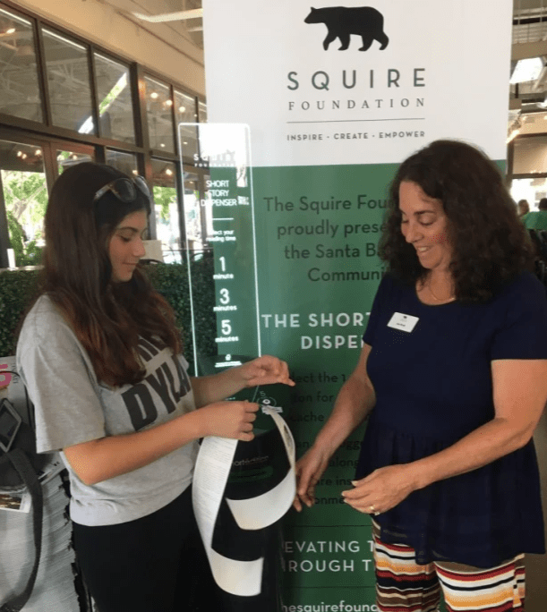 Jan Brody with daughter, Shira, in front of the Short Story Dispenser, at the Public Market’s Victoria Street entrance Jan Brody with daughter, Shira, in front of the Short Story Dispenser, at the Public Market’s Victoria Street entrance