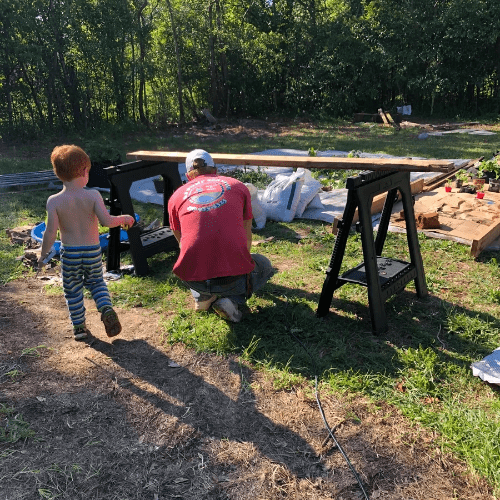 My husband and son assembling raised beds. My husband and son assembling raised beds.