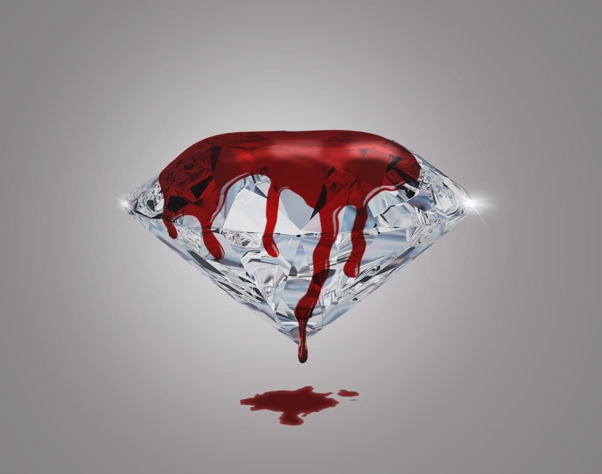 On a grey background is a shining diamond, with blood dripping from the top to the ground. On a grey background is a shining diamond, with blood dripping from the top to the ground.