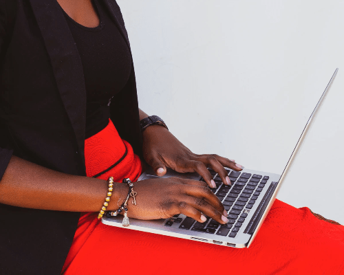 A woman works at a laptop. A woman works at a laptop.