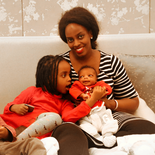 Laura and two of her children relax on a couch. Laura and two of her children relax on a couch.