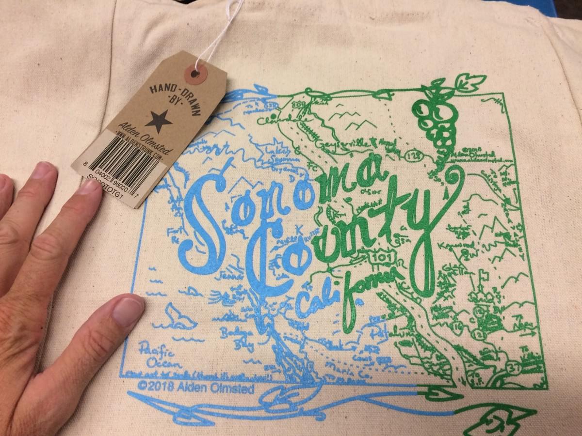 Sonoma County cotton tote bag for sale in Nugget Markets Sonoma Market Sonoma, CA ©2018 Alden Olmsted Sonoma County cotton tote bag for sale in Nugget Markets Sonoma Market Sonoma, CA ©2018 Alden Olmsted