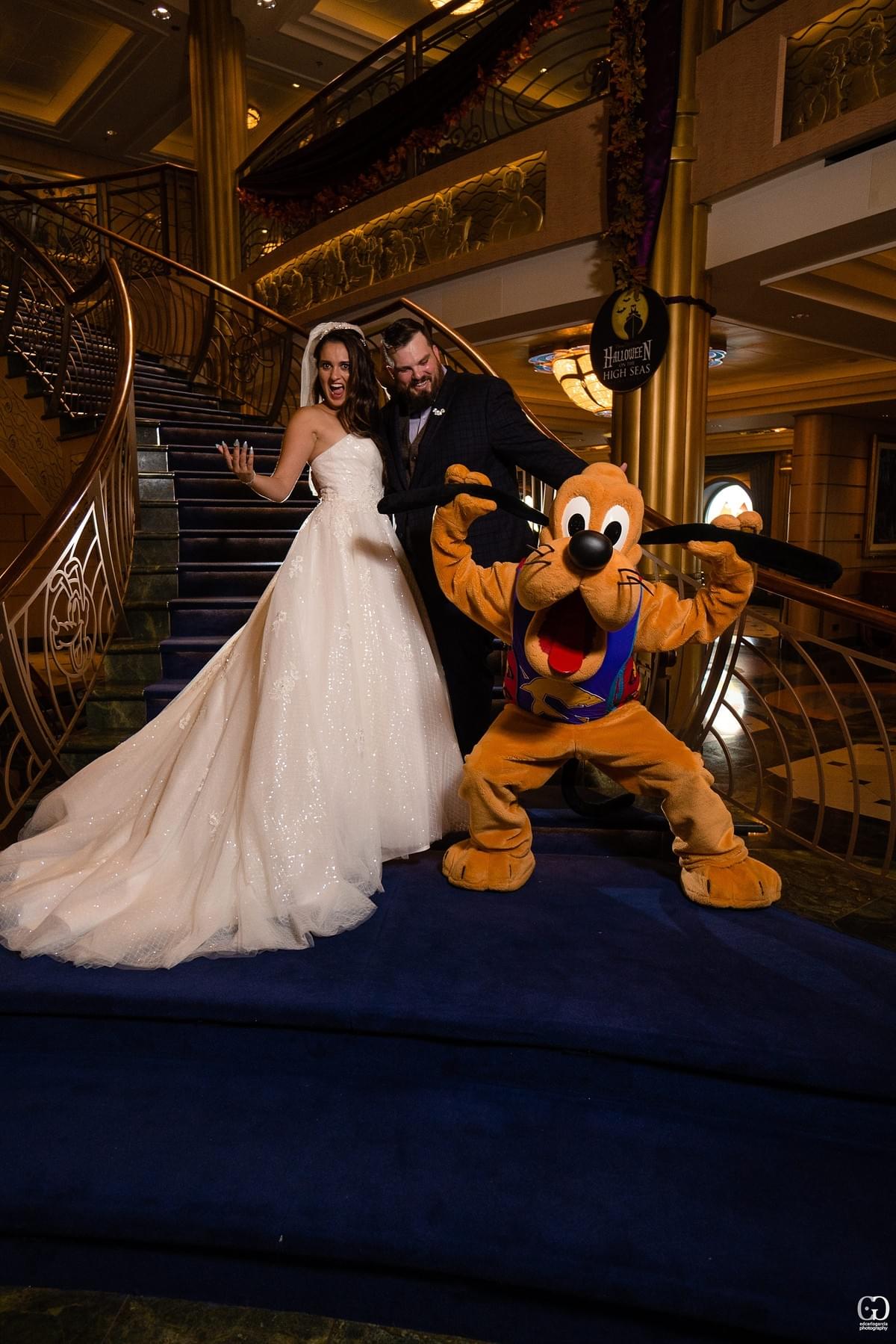 disney cruise line wedding castaway cay bahamas carribean cruise photos of groom and bride with goofy at the stairs disney cruise line wedding castaway cay bahamas carribean cruise photos of groom and bride with goofy at the stairs
