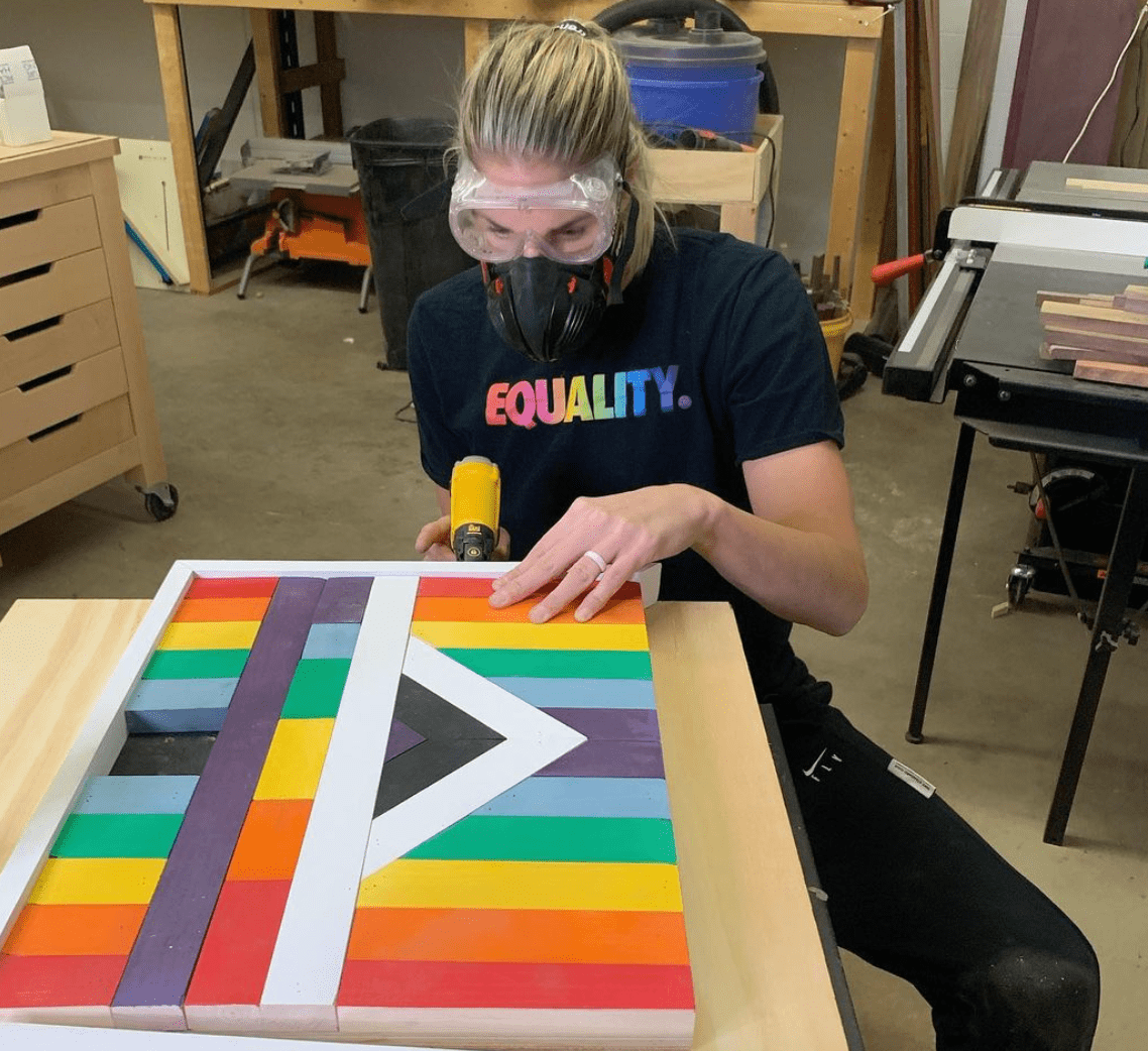 Elena works on rainbow backboard design wearing Equality T-Shit Elena works on rainbow backboard design wearing Equality T-Shit