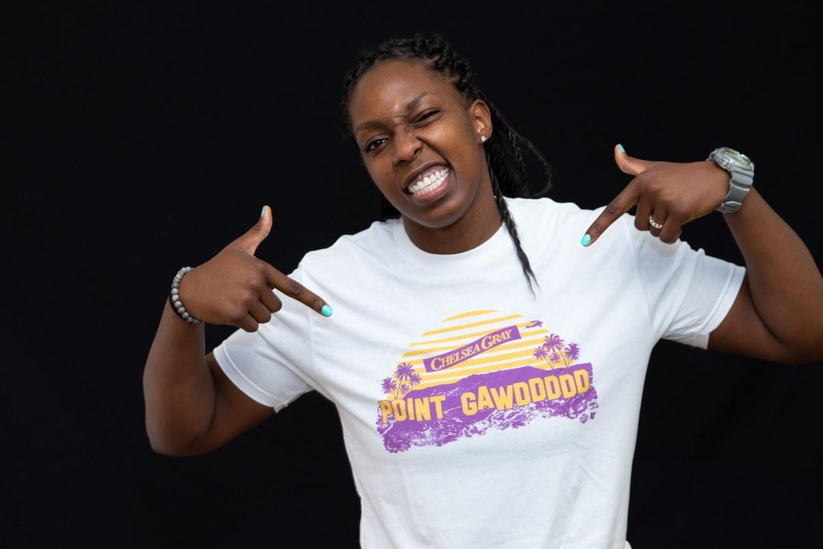 Chelsea Gray points at text of T-shirt, which says "POINT GAWDDDDD" where the Hollywood sign should be Chelsea Gray points at text of T-shirt, which says "POINT GAWDDDDD" where the Hollywood sign should be