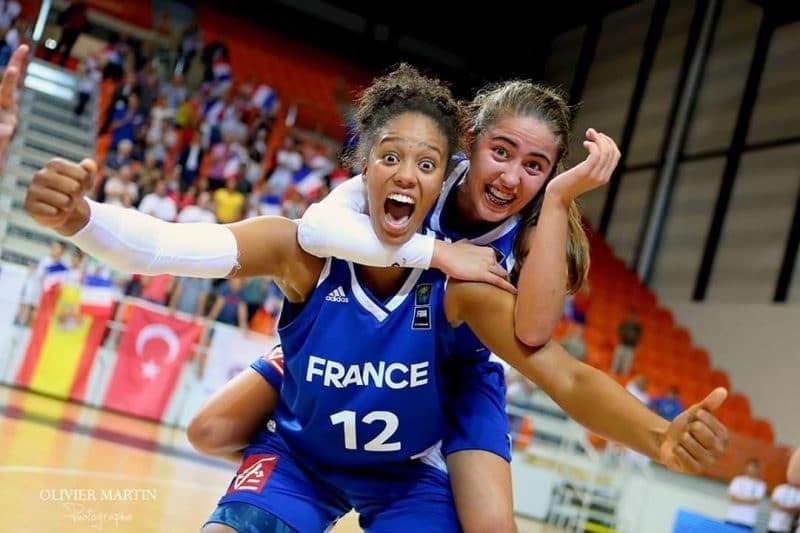 Iliana looks like she is yelling at the camera holding teammate on her back. Iliana looks like she is yelling at the camera holding teammate on her back.