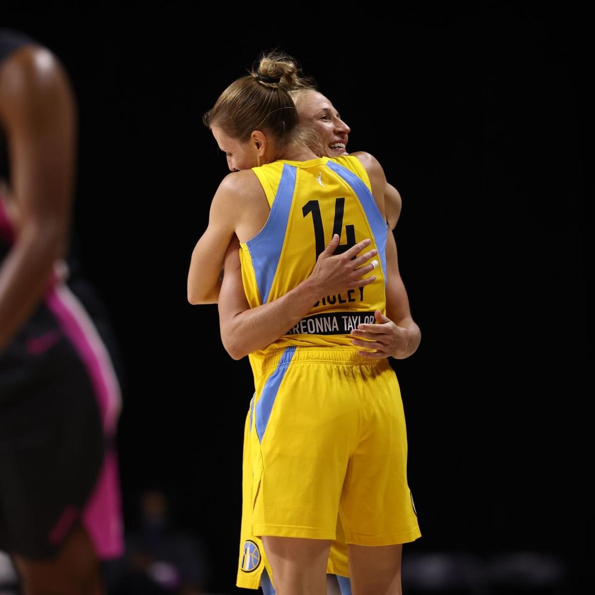 Allie and Courtney hugging on the court. Allie and Courtney hugging on the court.