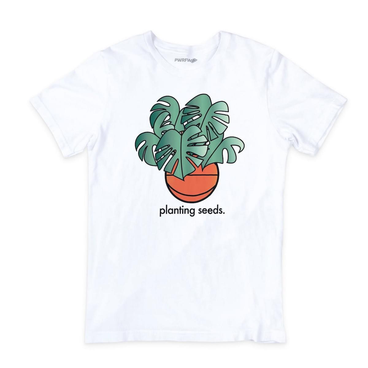 White shirt with text "planting seeds" and image of green leaves growing out of a basketball White shirt with text "planting seeds" and image of green leaves growing out of a basketball