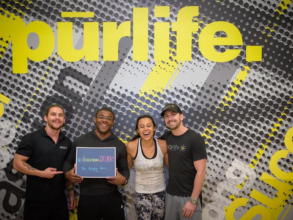Photo of smiling team members from Purlife in downtown Delray Beach. Photo of smiling team members from Purlife in downtown Delray Beach.
