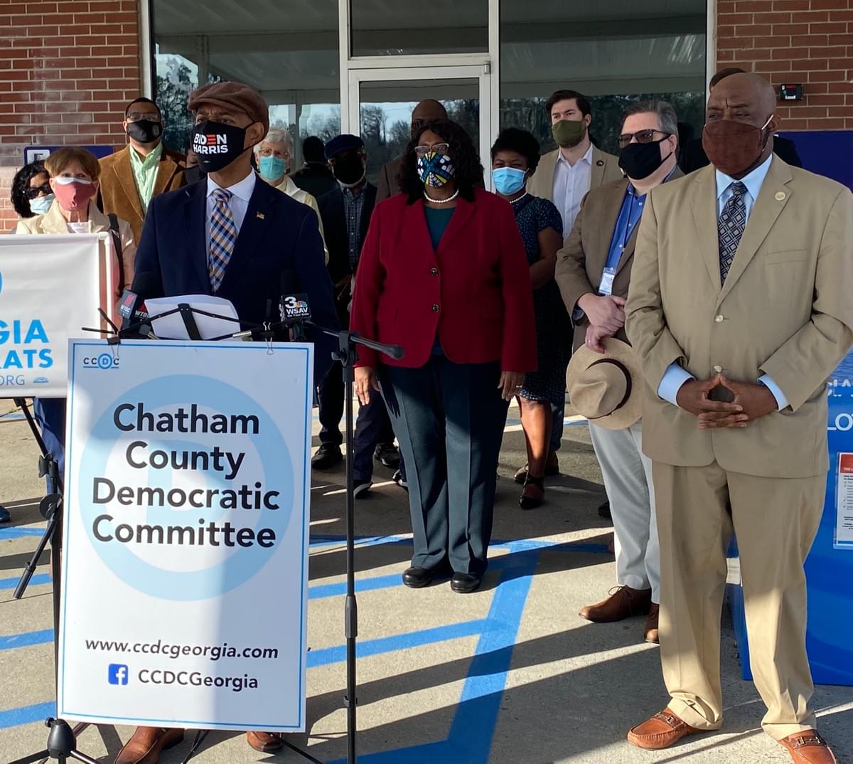 Speaker: Jay Jones, Chairman, Chatham County Democratic Committee, Right/Tan Suit: Savannah Mayor Van Johnson, Center in Red: Mayor Pro-Tiem, Dr. Estella Edwards Shabazz, Background: Chatham County Democratic Committee Post Seat Holders and City/County Elected Leadership Speaker: Jay Jones, Chairman, Chatham County Democratic Committee, Right/Tan Suit: Savannah Mayor Van Johnson, Center in Red: Mayor Pro-Tiem, Dr. Estella Edwards Shabazz, Background: Chatham County Democratic Committee Post Seat Holders and City/County Elected Leadership