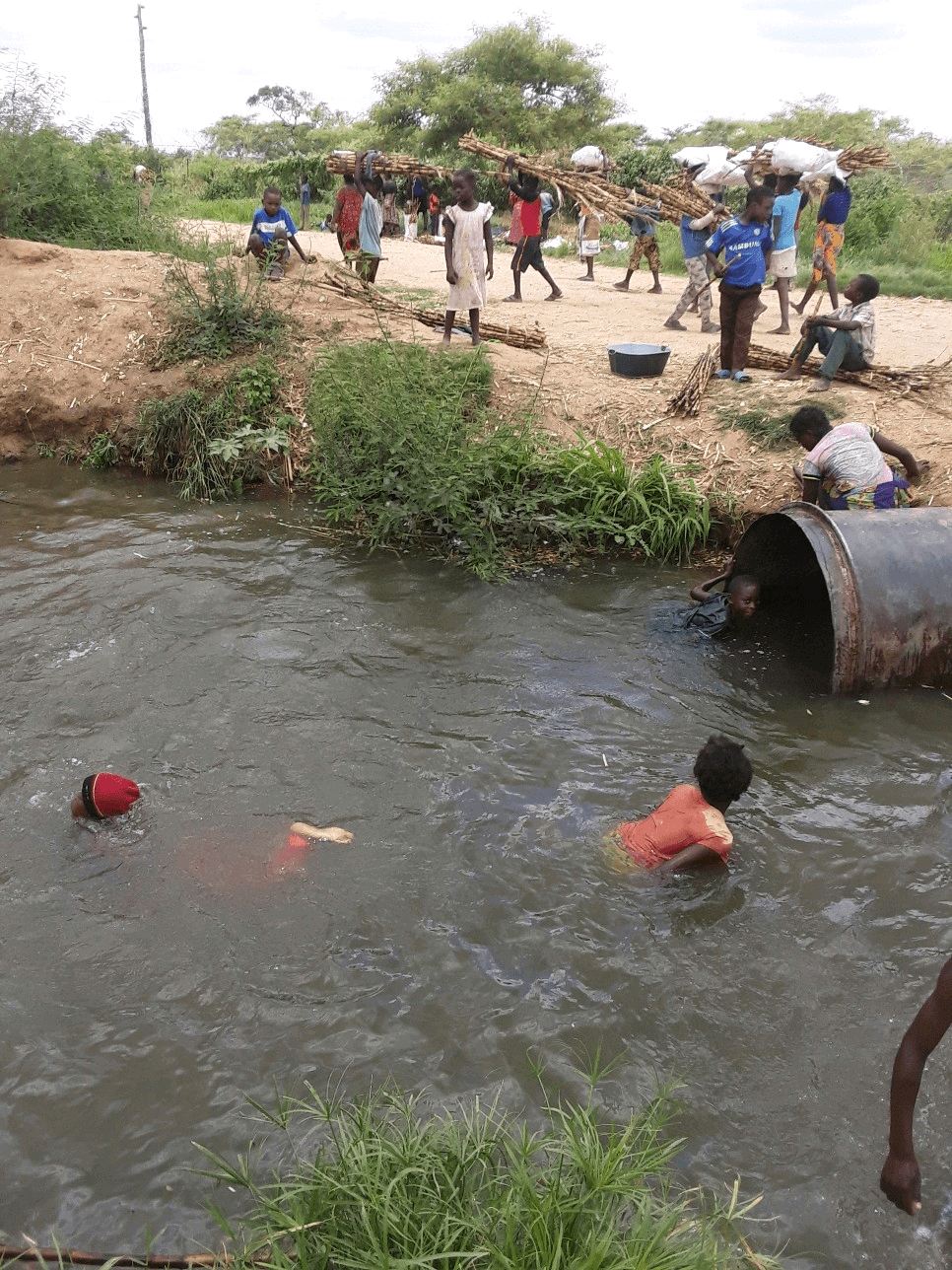 Children playing in the Zambesi, close to where they monitor the water. Photo credit: Ceswe Mpandamabula Children playing in the Zambesi, close to where they monitor the water. Photo credit: Ceswe Mpandamabula