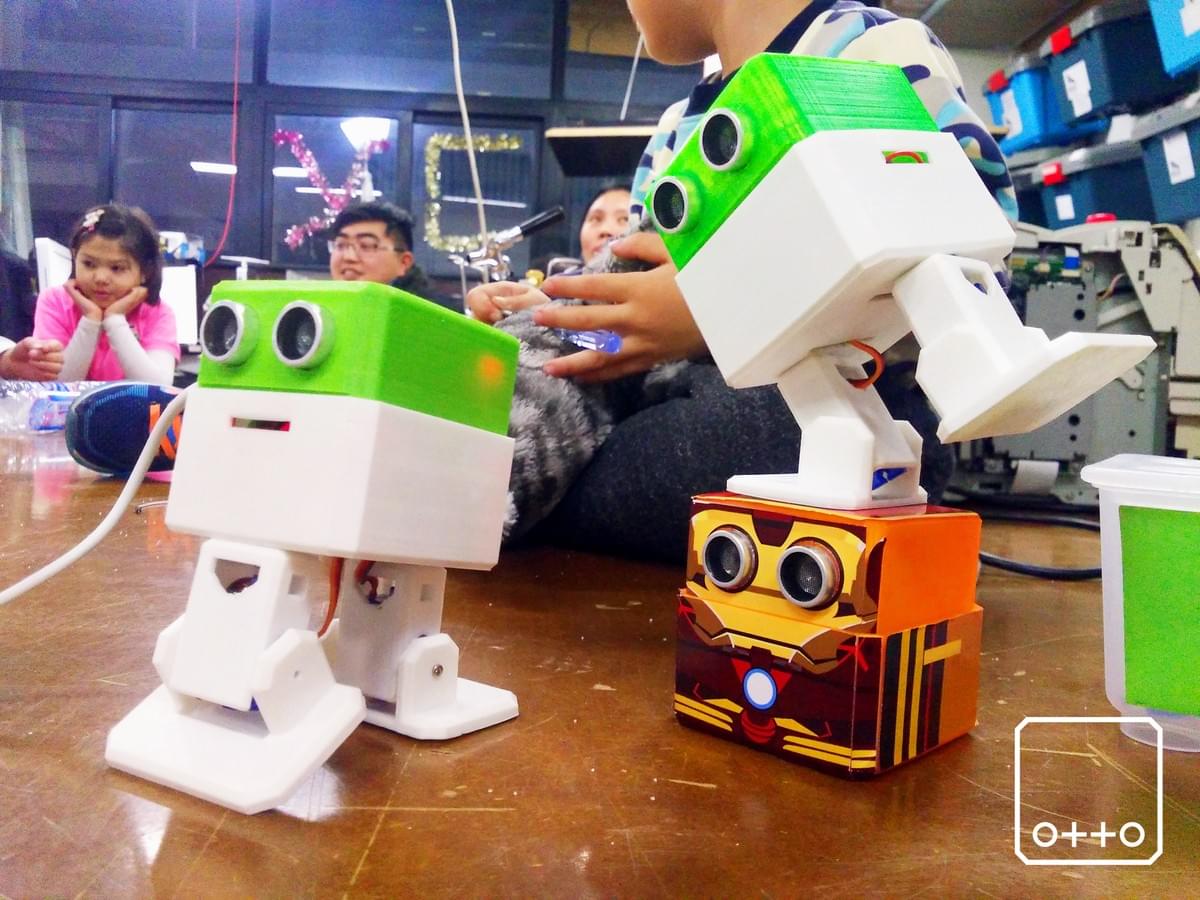 Programmable robot on a table in a classroom setting Programmable robot on a table in a classroom setting