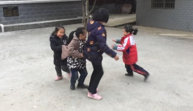Girls Playing: Mother Hen protects her chics from the fox in red Girls Playing: Mother Hen protects her chics from the fox in red