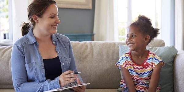 Child talking to an expert. Child talking to an expert.